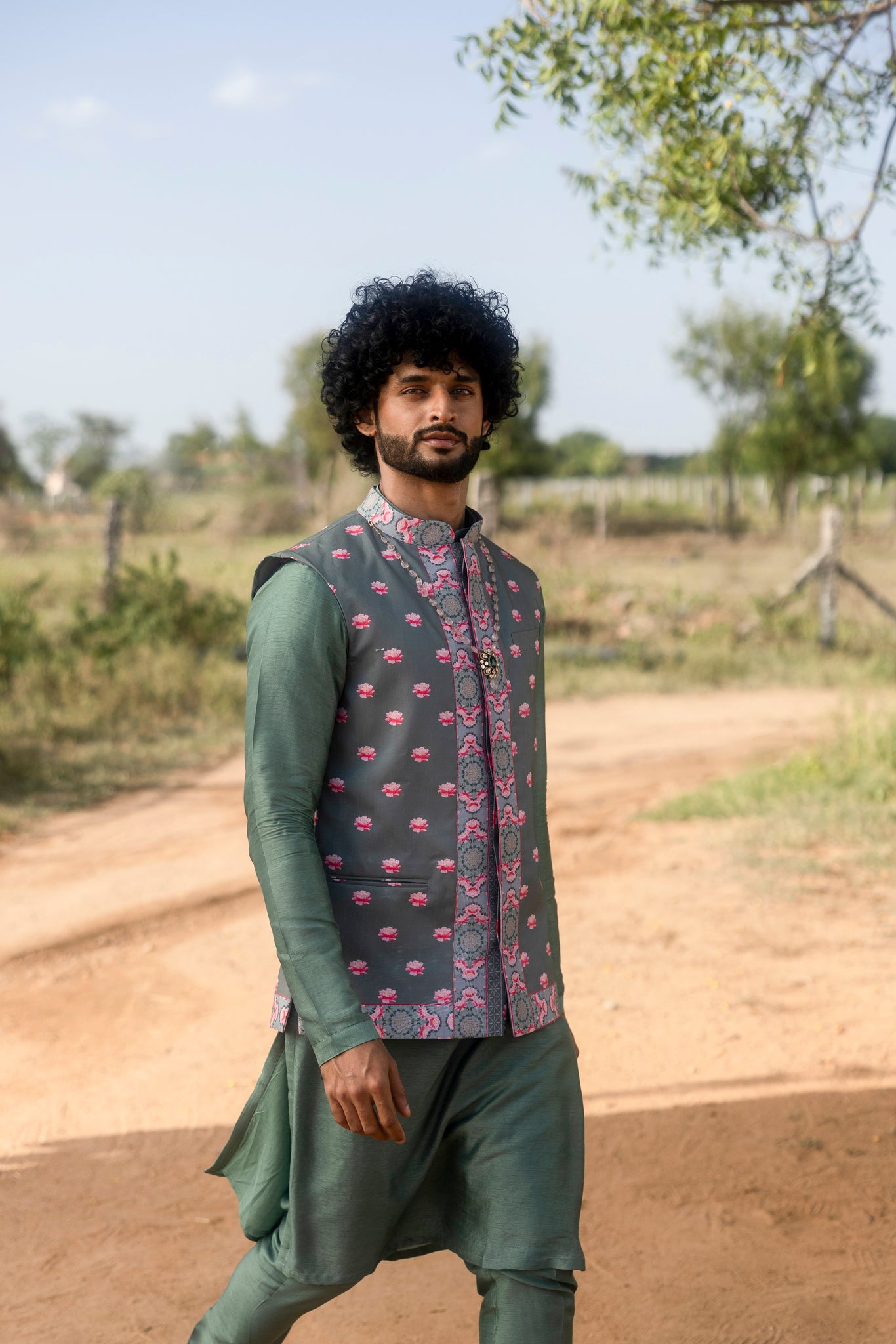 Green silk kurta set with printed jacket