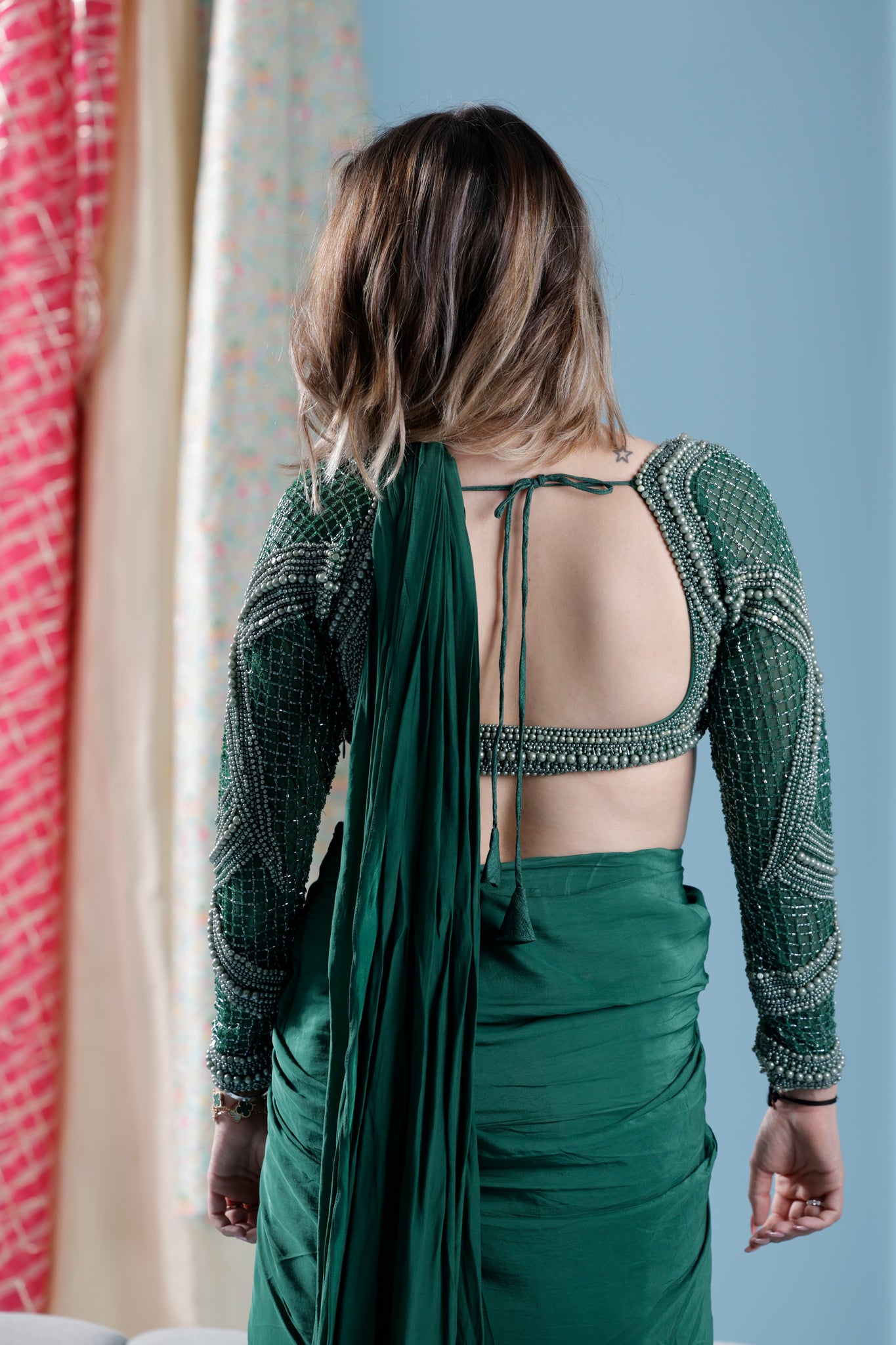 Green pre draped saree with heavy hand embroidered blouse