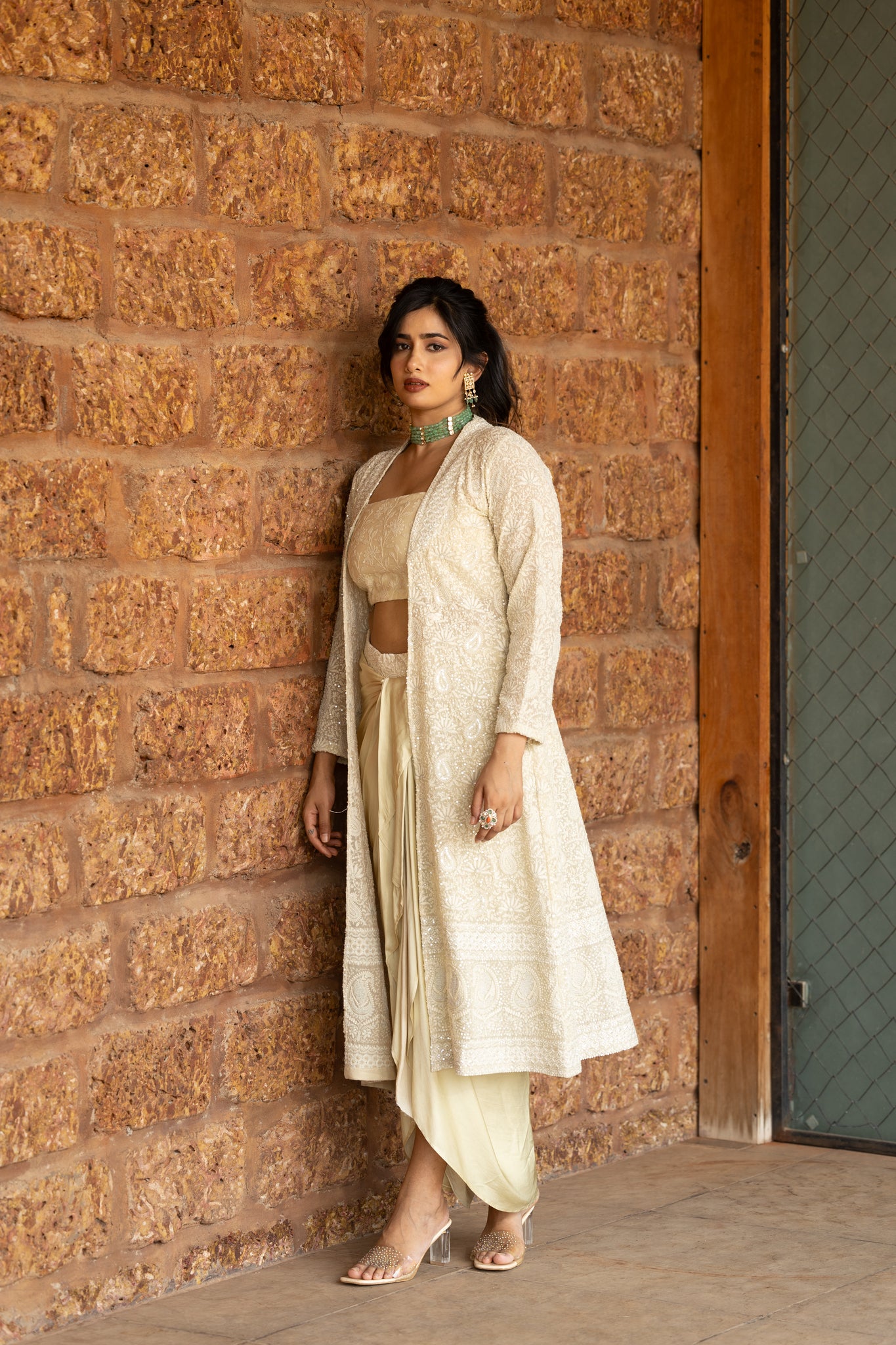 Chikankari jacket paired with chikankari blouse and crepe silk drape skirt