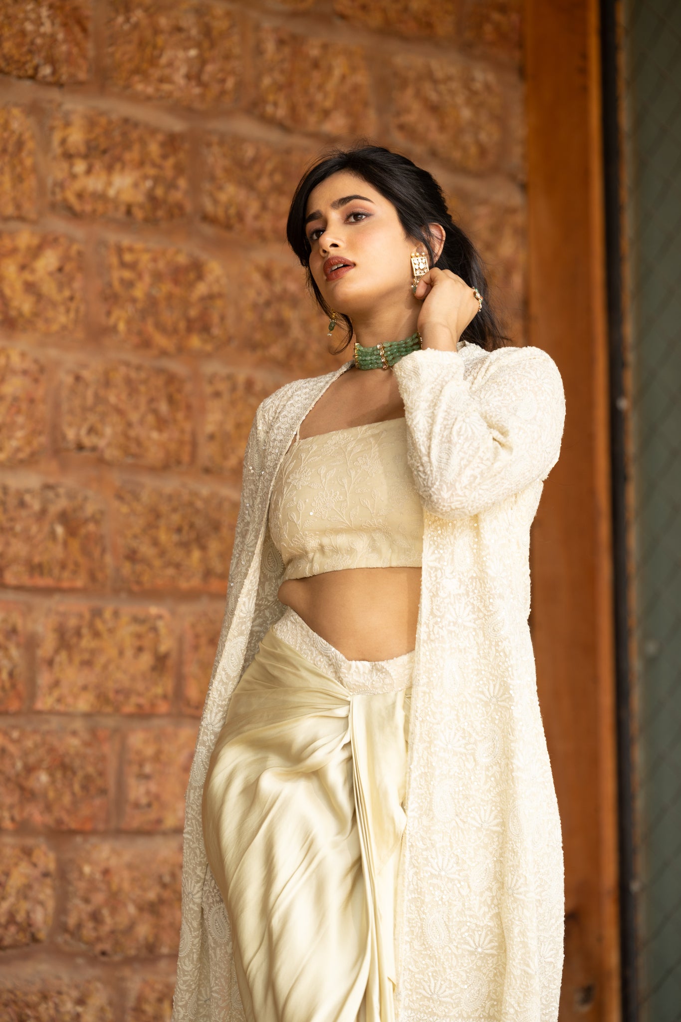 Chikankari jacket paired with chikankari blouse and crepe silk drape skirt