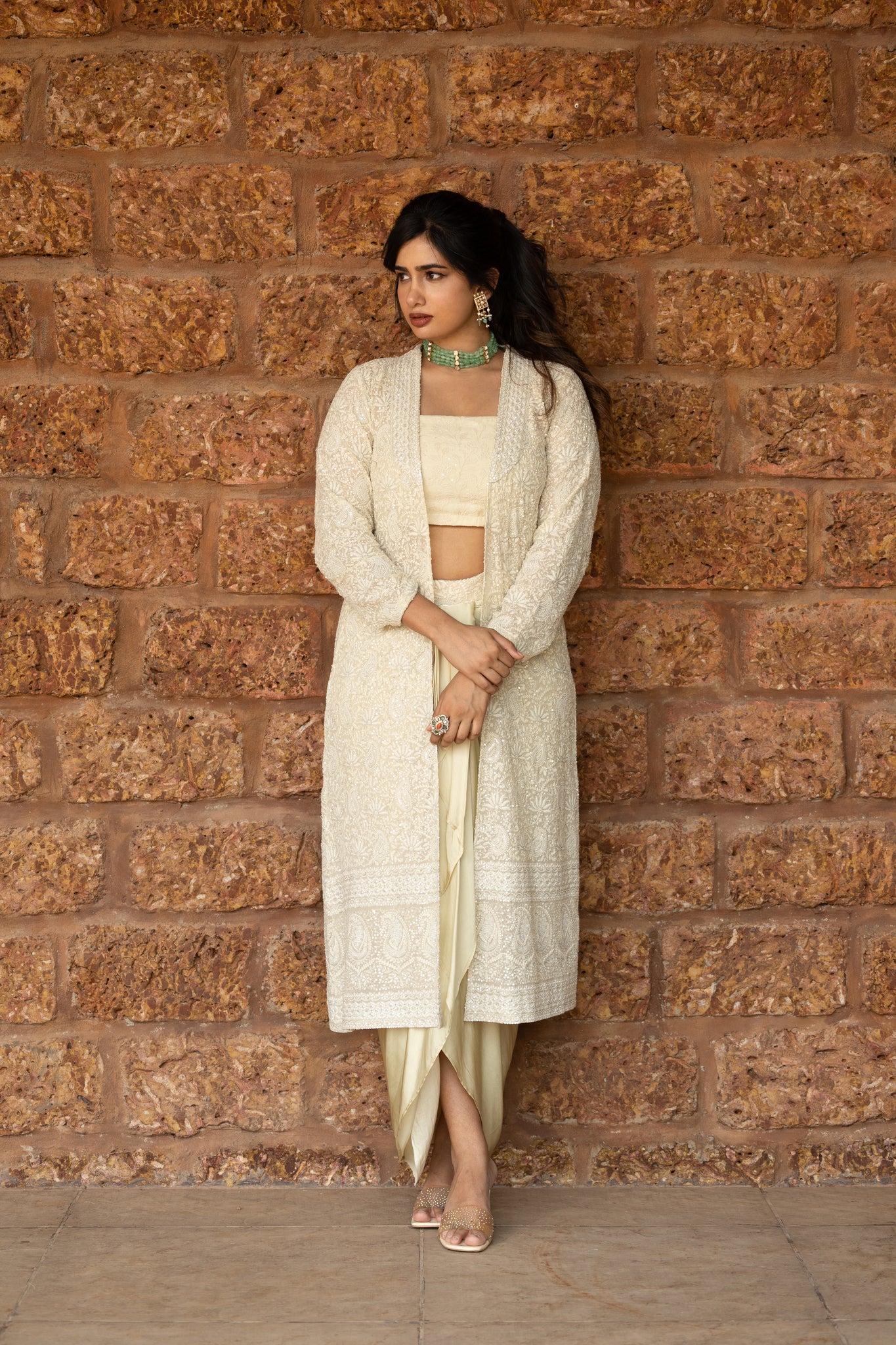 Chikankari jacket paired with chikankari blouse and crepe silk drape skirt