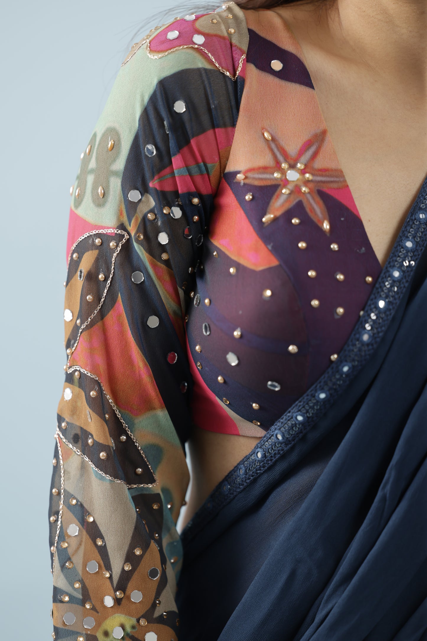 Pre draped saree with printed fabric ruffles and full sleeve blouse