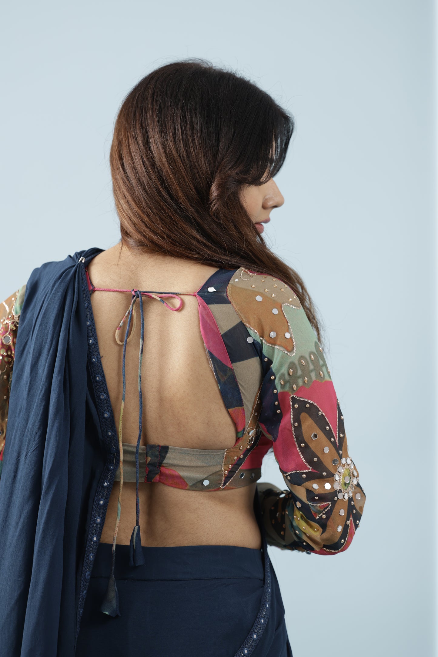 Pre draped saree with printed fabric ruffles and full sleeve blouse