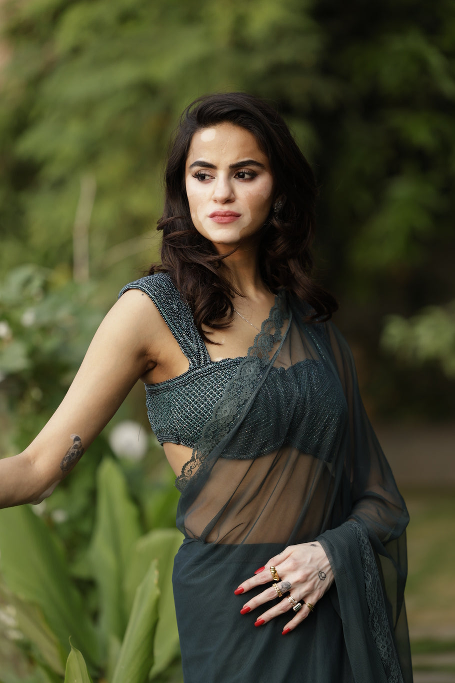 Forest green saree with heavy hand embroidered blouse