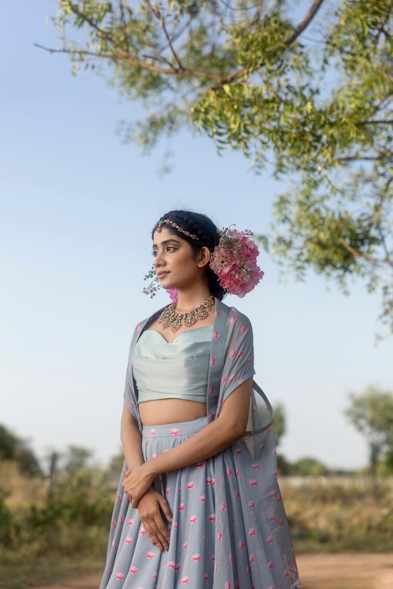 Printed lehenga with pleated blouse and organza cape