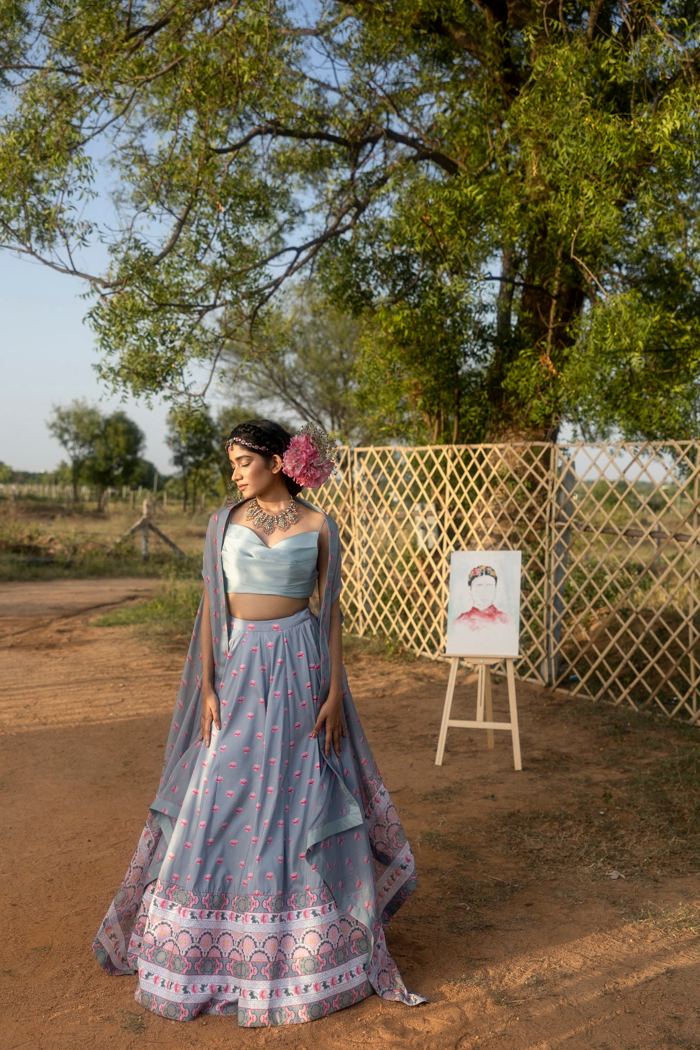 Printed lehenga with pleated blouse and organza cape