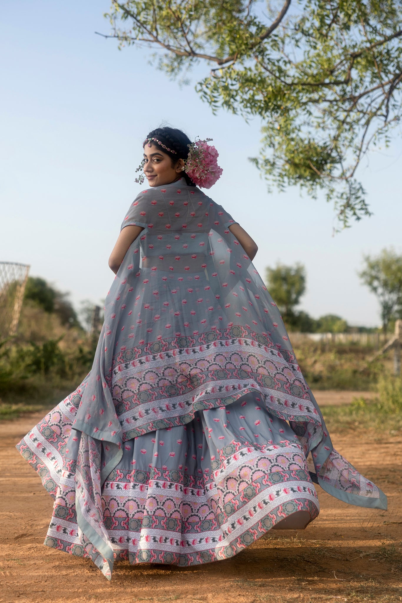 Printed lehenga with pleated blouse and organza cape